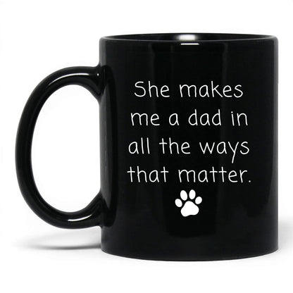 She Makes Me a Dad Mug – 11oz Black Mug