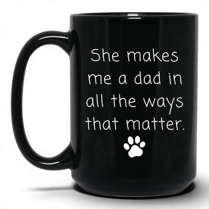 She Makes Me a Dad Mug – 15oz Black Mug