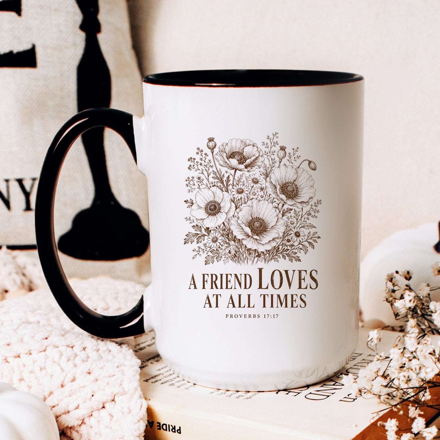 A Friend Loves at All Times coffee mug