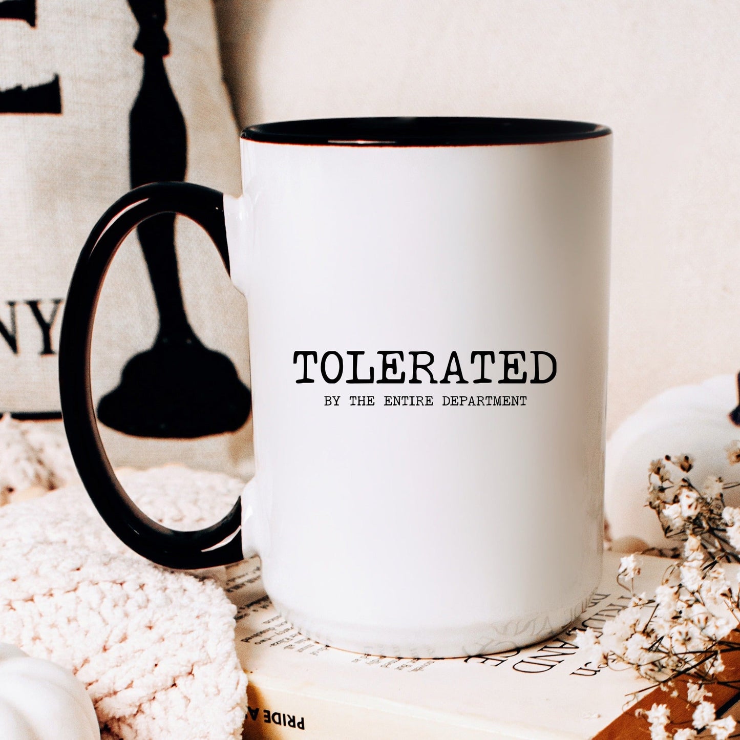 Tolerated by the entire department funny coworker coffee mug