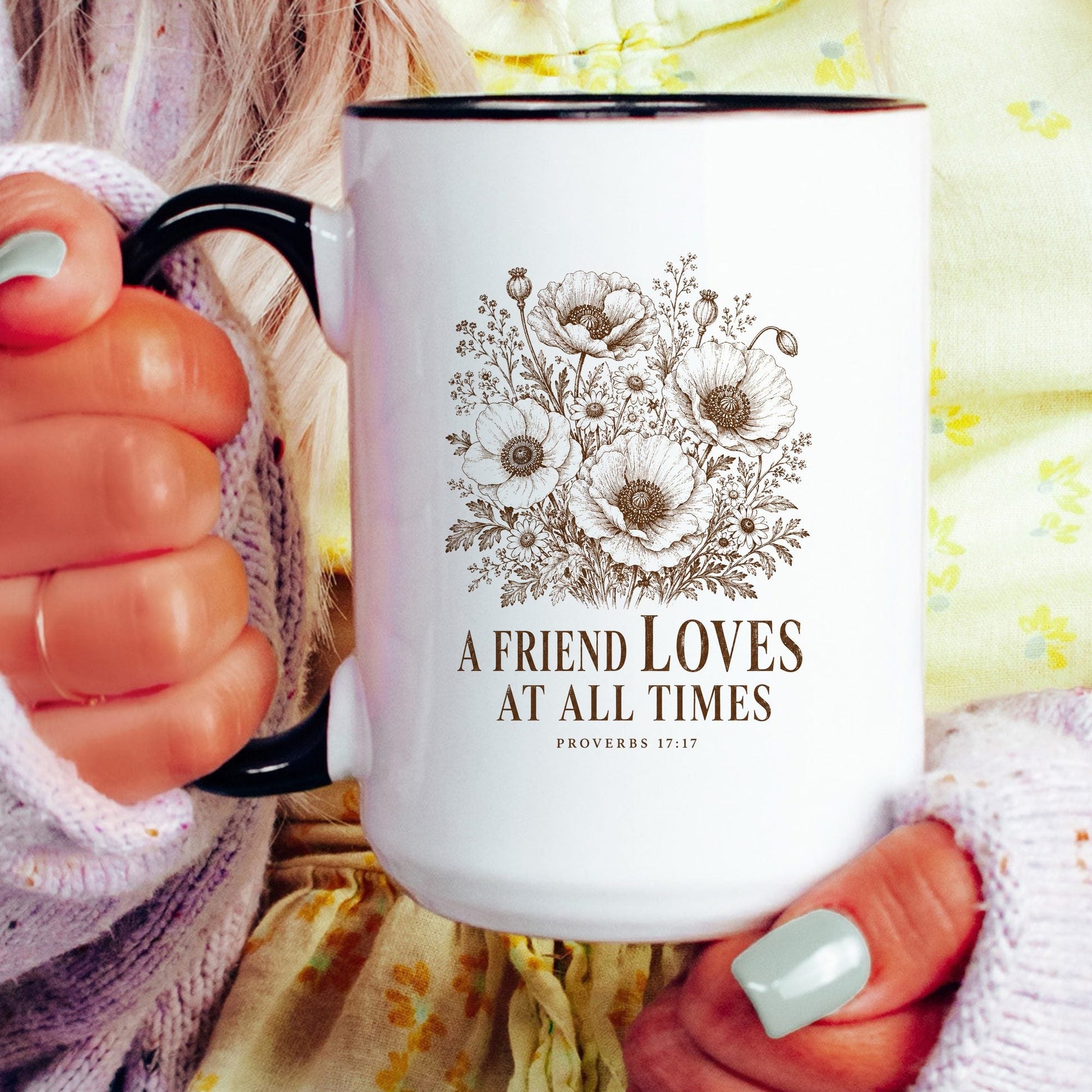 A Friend Loves at All Times coffee mug held by a model