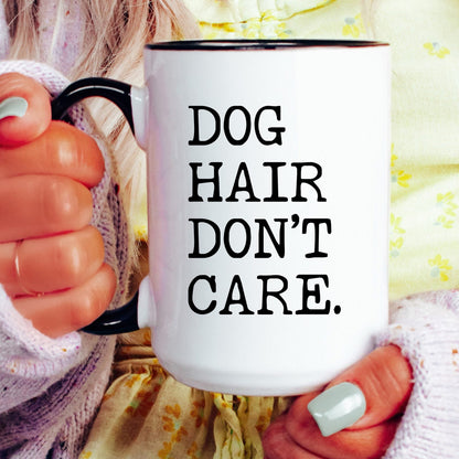 Dog Hair Don’t Care coffee mug held by a model