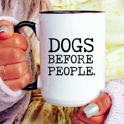 Dogs Before People coffee mug held by a model