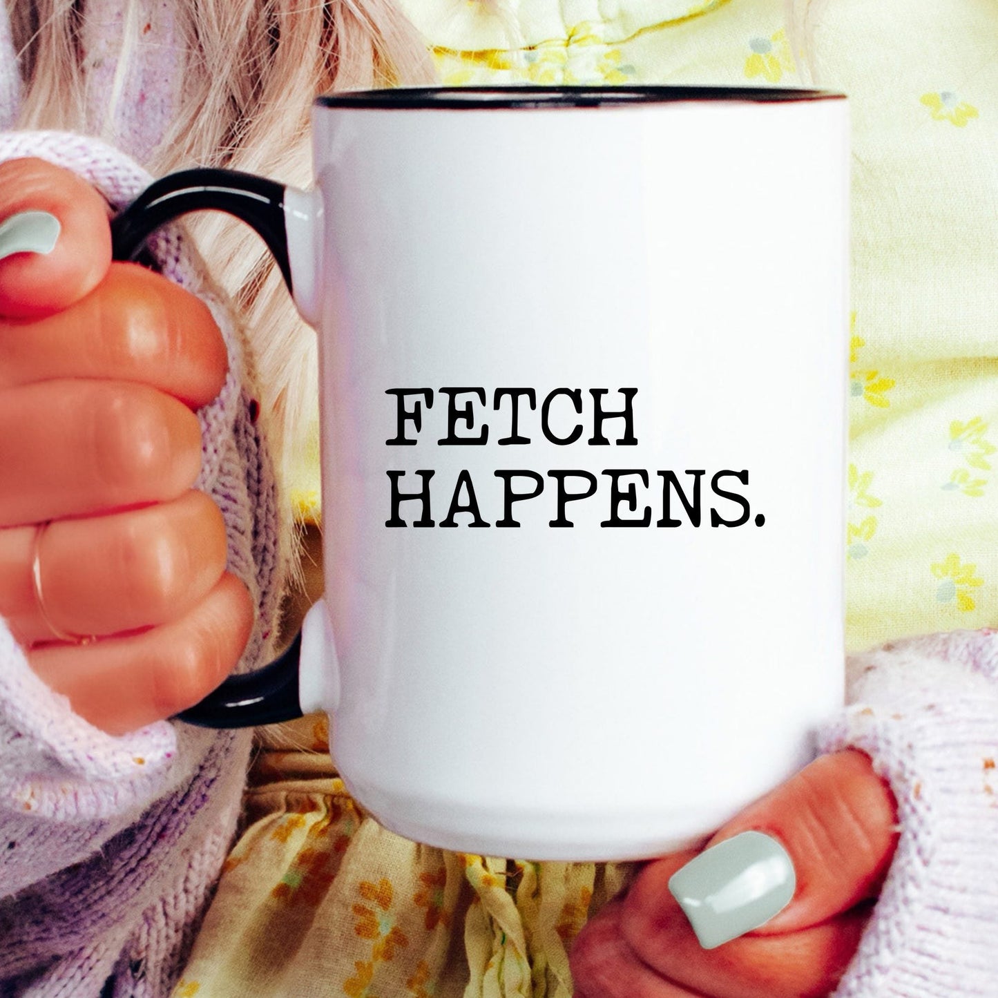Fetch Happens coffee mug held by a model