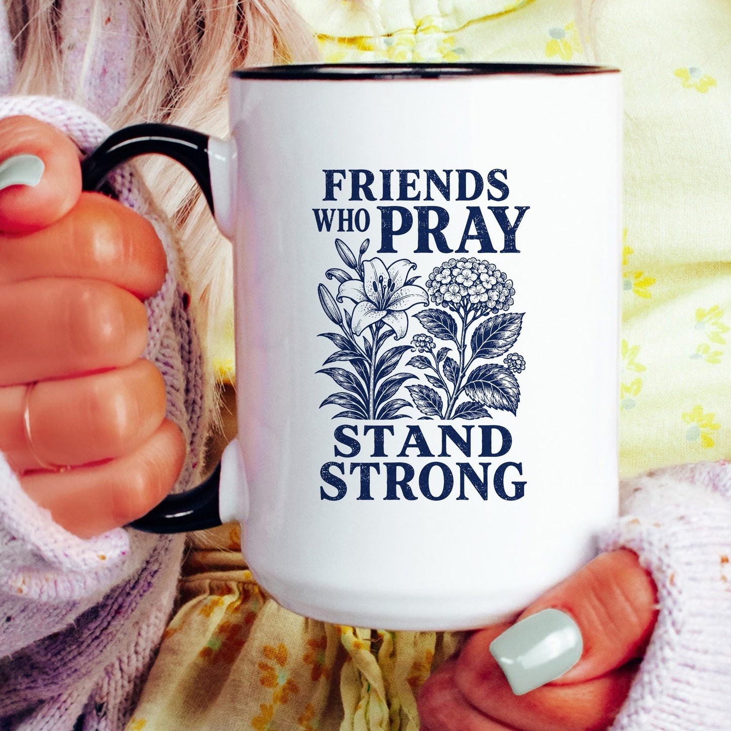 Friends Who Pray Stand Strong coffee mug held by a model