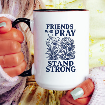 Friends Who Pray Stand Strong coffee mug held by a model