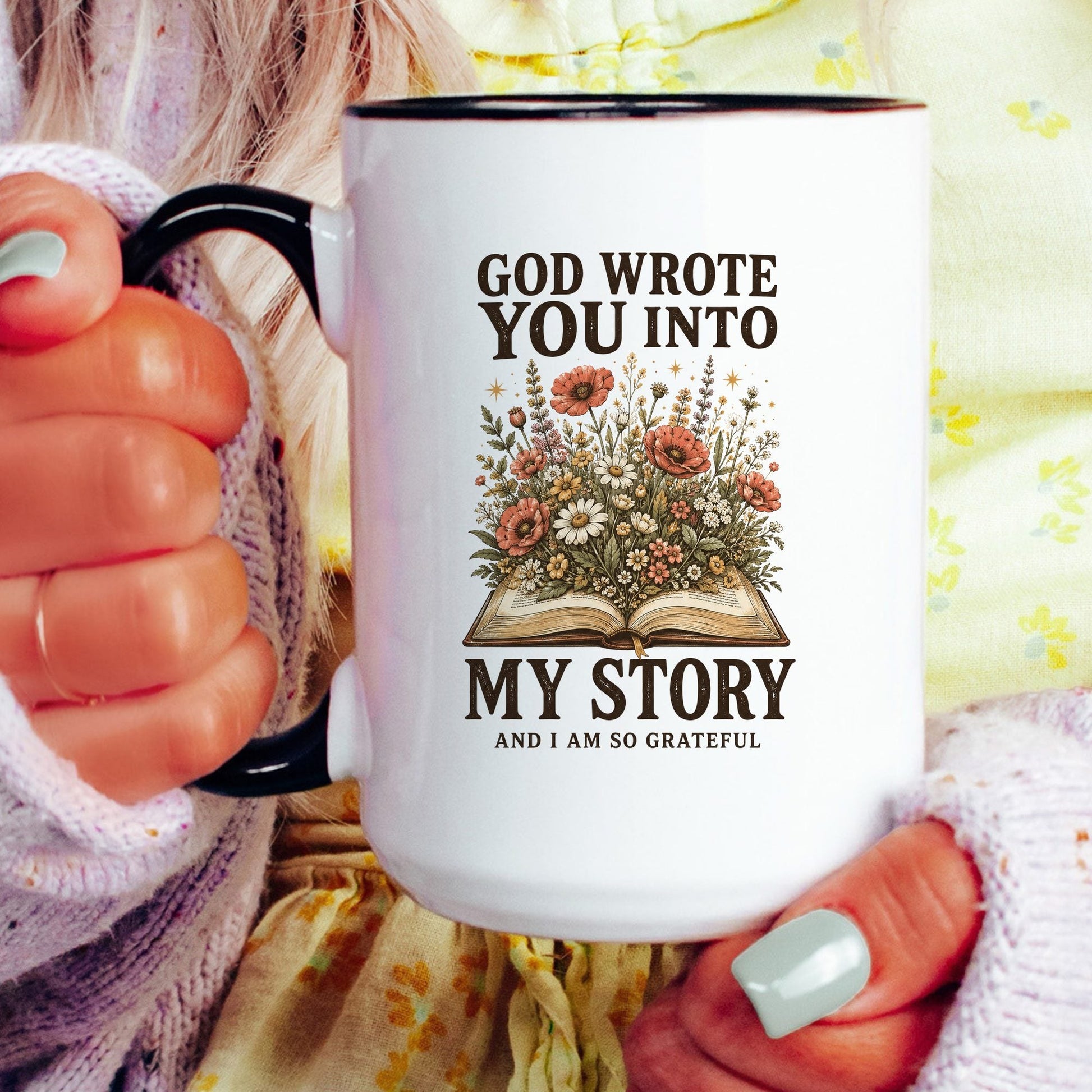 God Wrote You Into My Story coffee mug held by a model