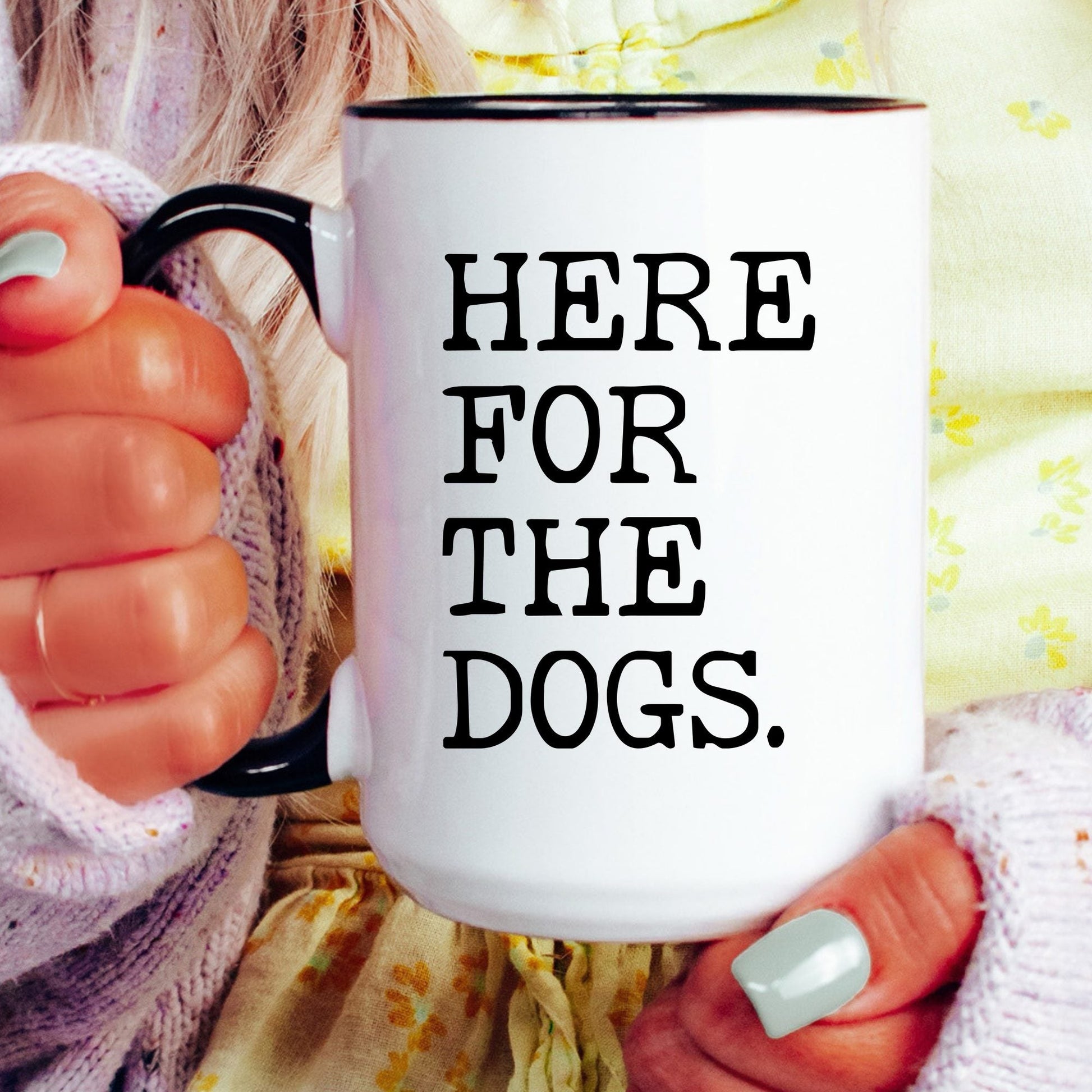 Here for the Dogs coffee mug held by a model