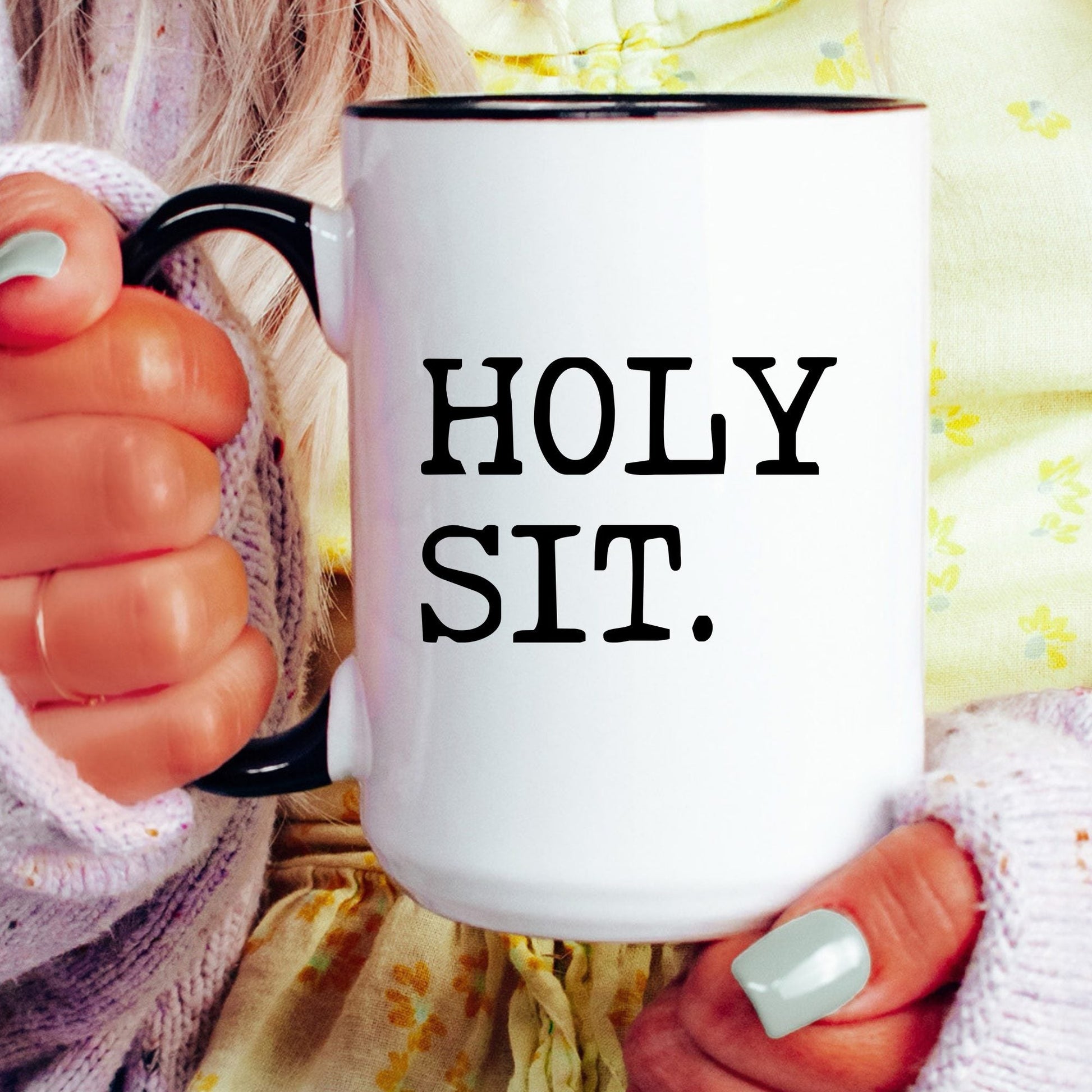 Holy Sit coffee mug held by a model