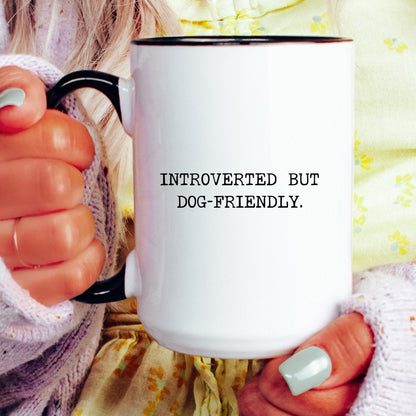 Introverted but Dog-Friendly coffee mug held by a model