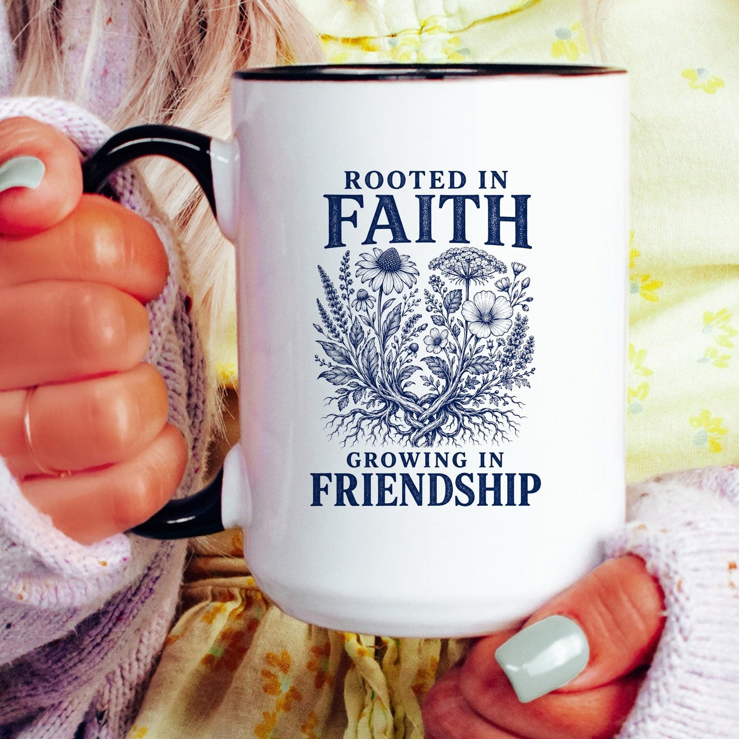 Rooted in Faith, Growing in Friendship coffee mug held by a model