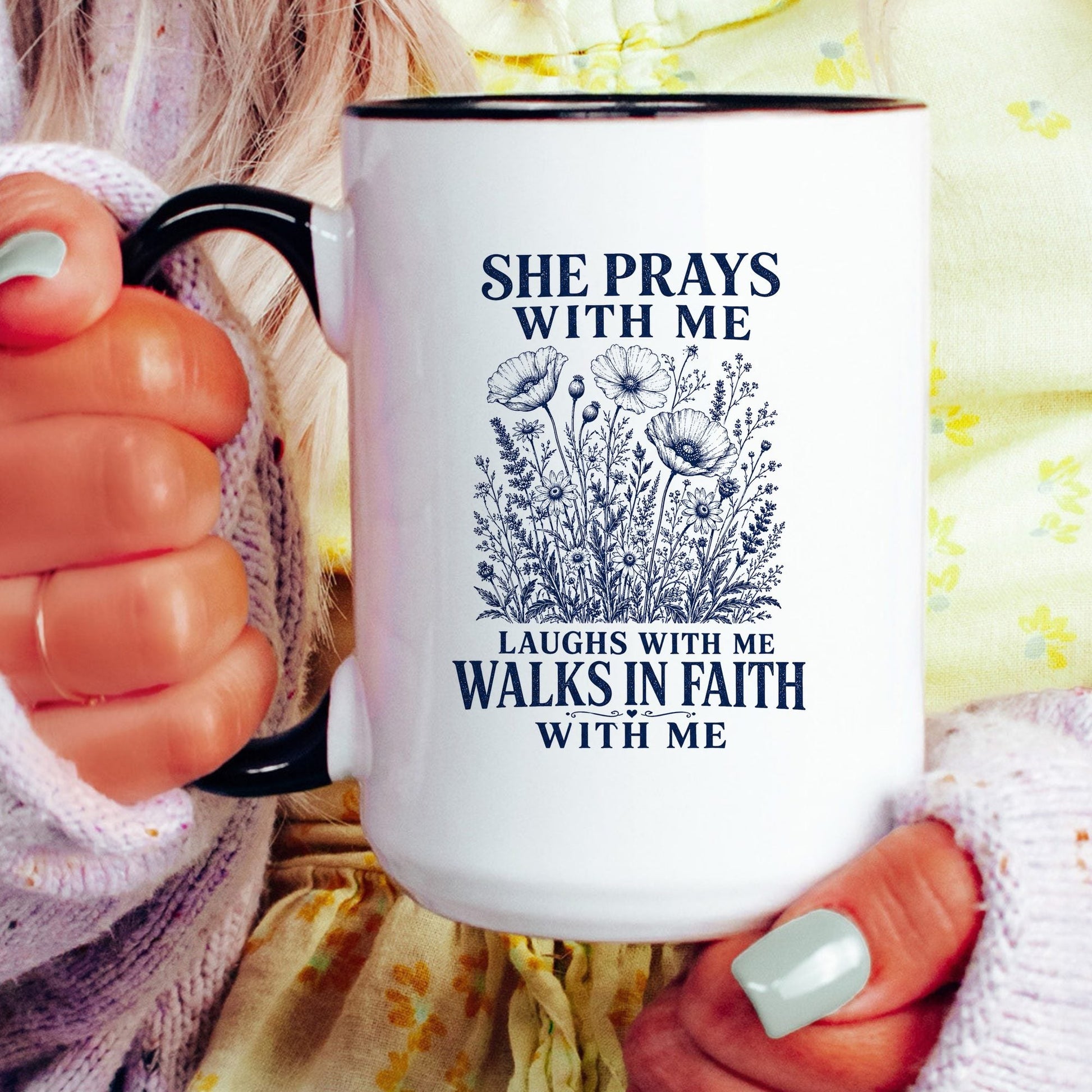 She Prays With Me, Laughs With Me, Walks in Faith With Me coffee mug held by a model