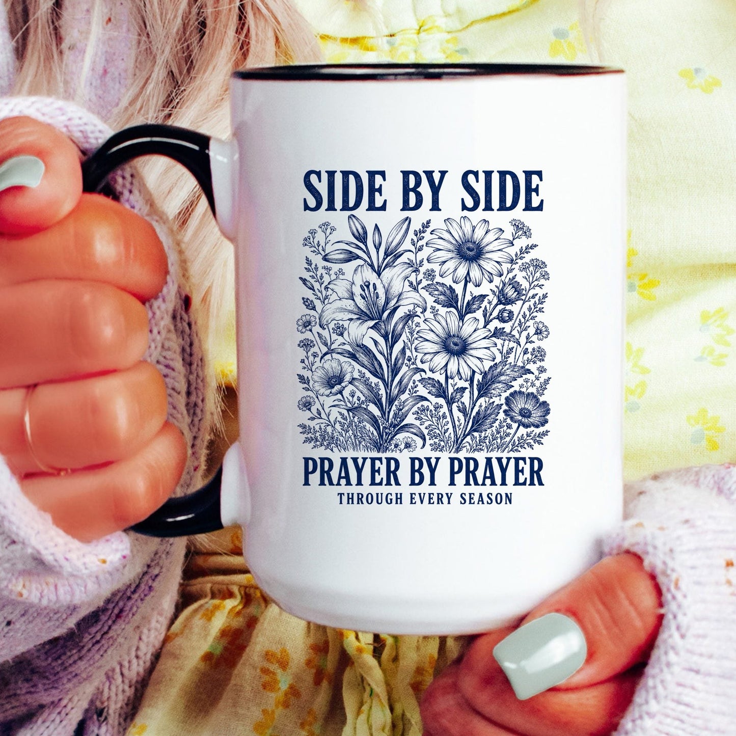 Side by Side, Prayer by Prayer coffee mug held by a model