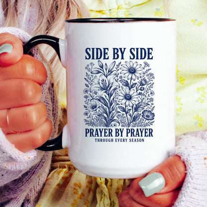 Side by Side, Prayer by Prayer coffee mug held by a model