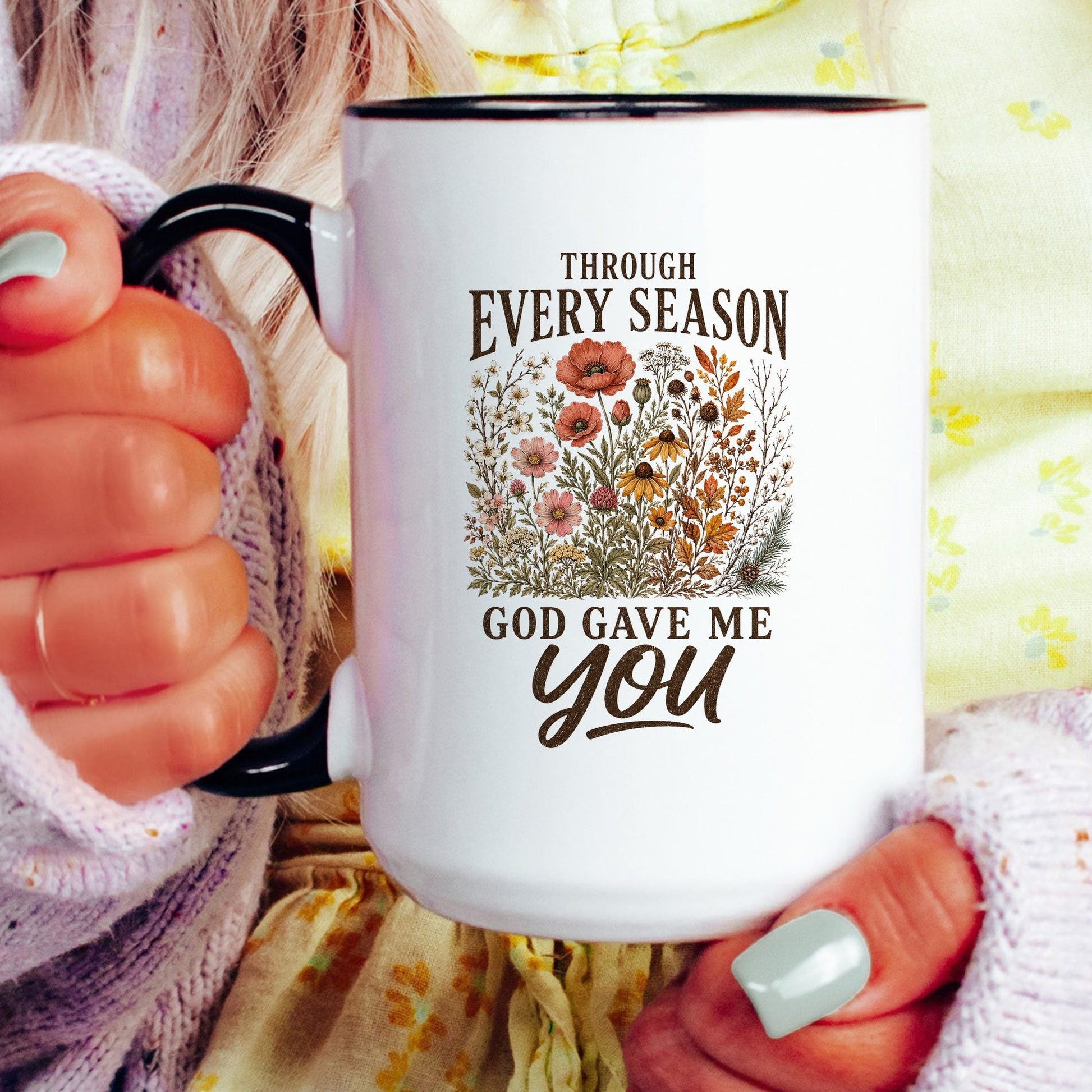 Through Every Season, God Gave Me You coffee mug held by a model