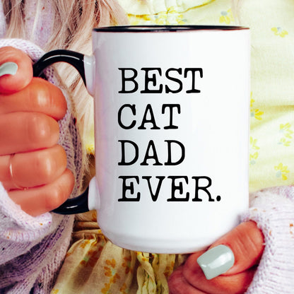 Best Cat Dad Ever coffee mug held by a model