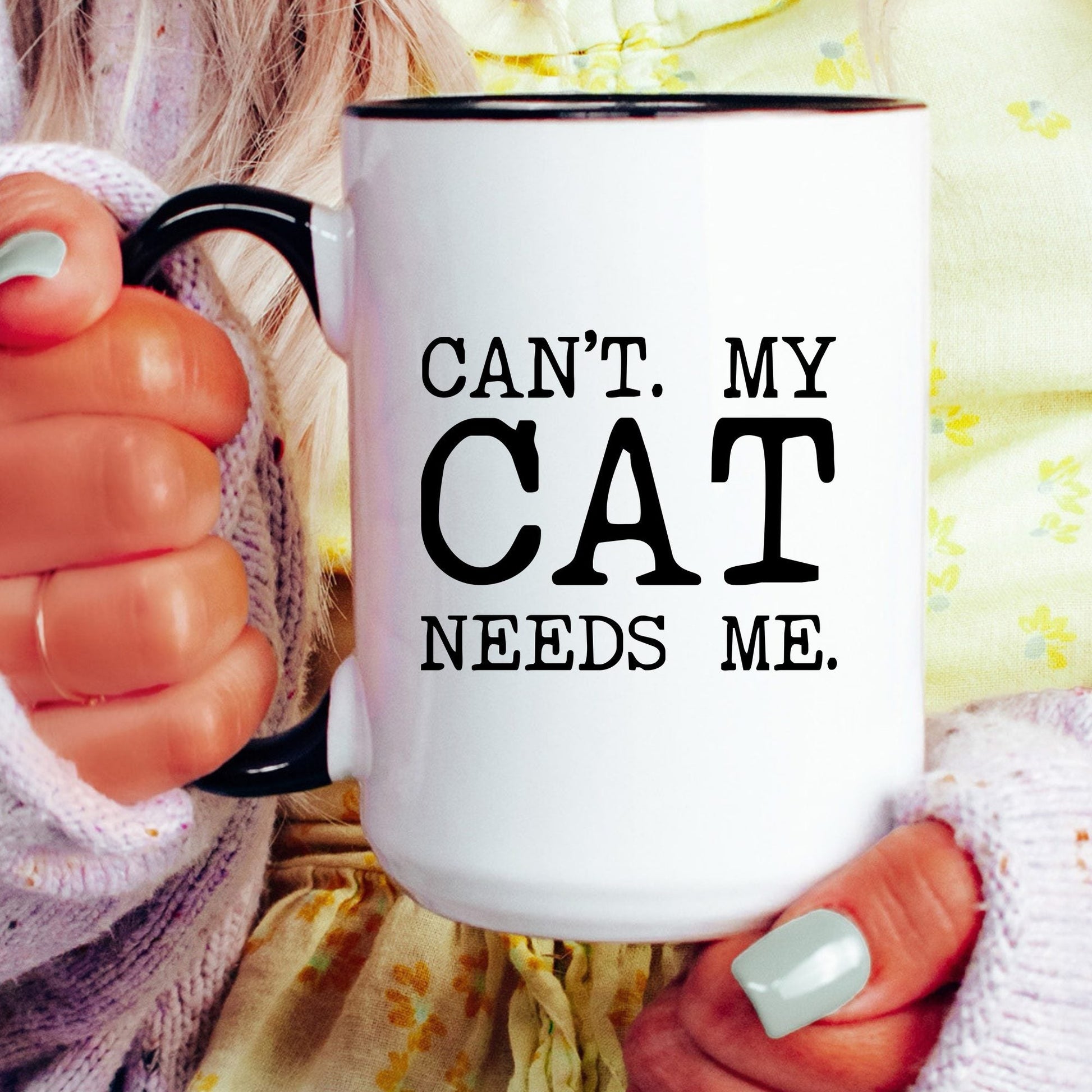 Can’t My Cat Needs Me coffee mug held by a model