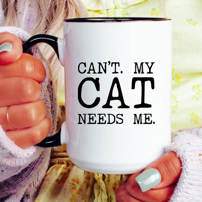Can’t My Cat Needs Me coffee mug held by a model