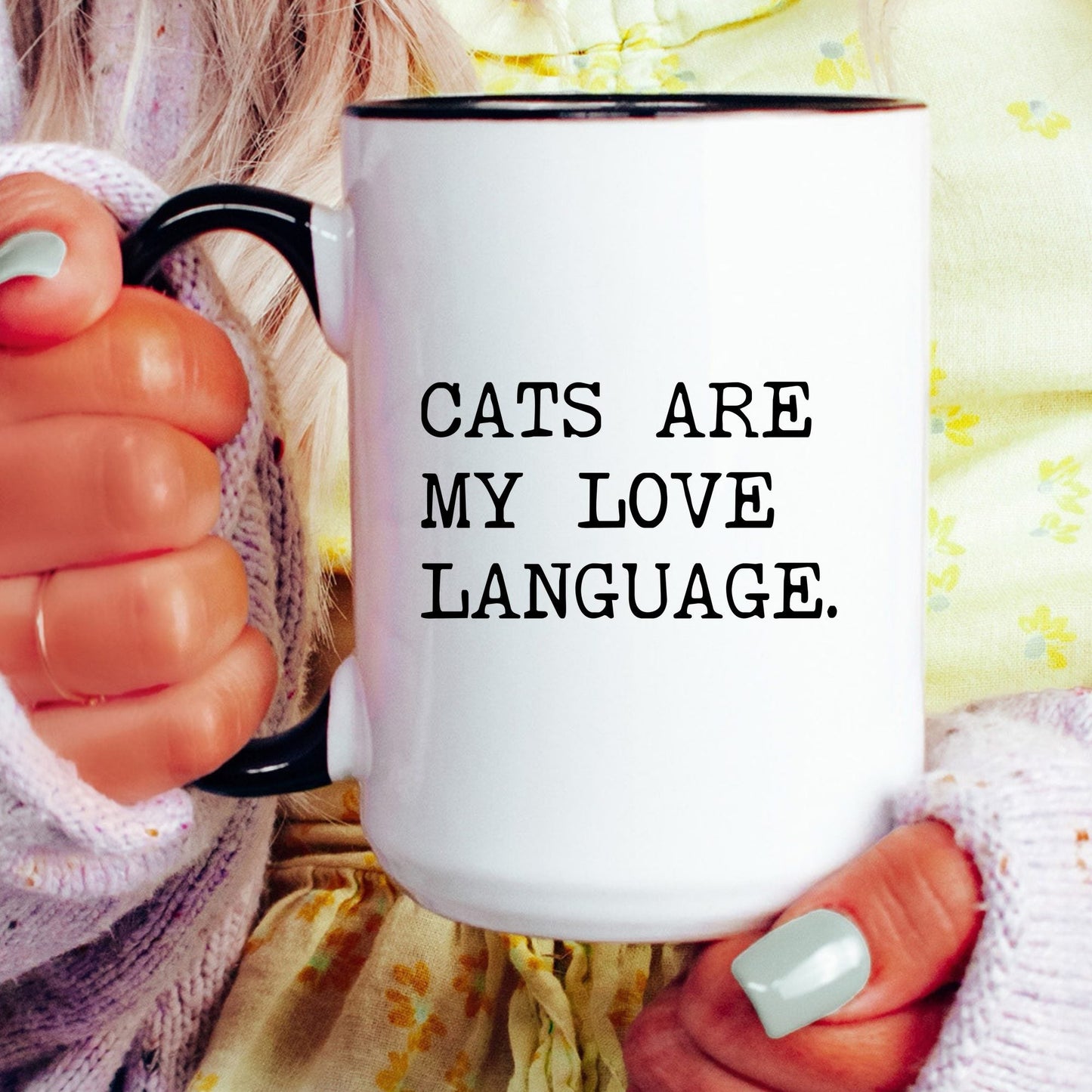Cats Are My Love Language coffee mug held by a model