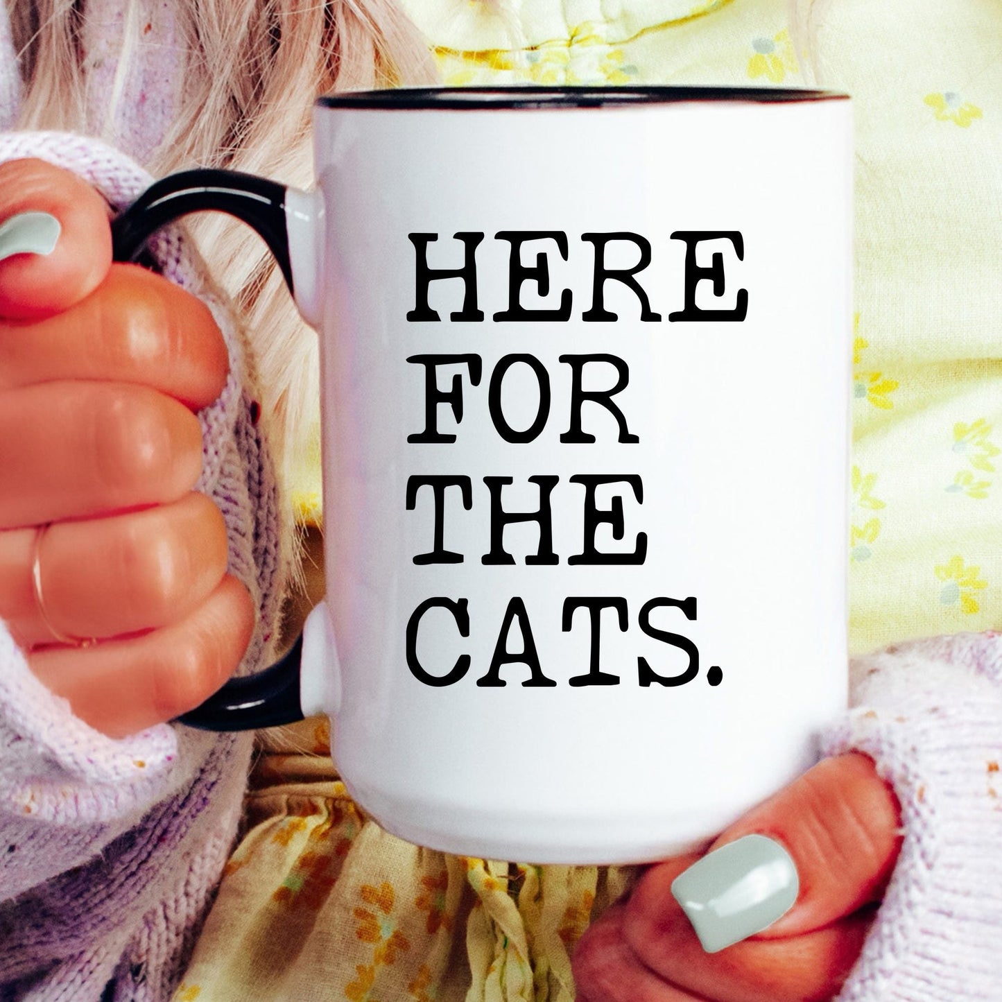 Here for the Cats coffee mug held by a model