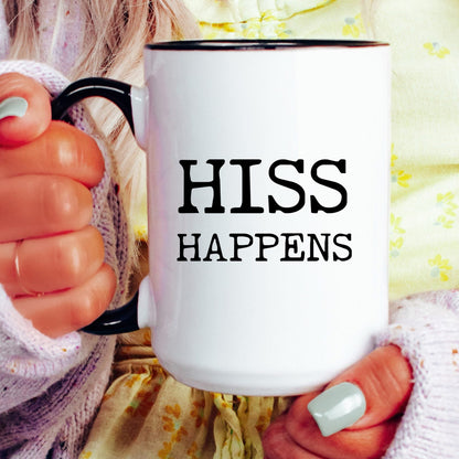 Hiss Happens coffee mug held by a model