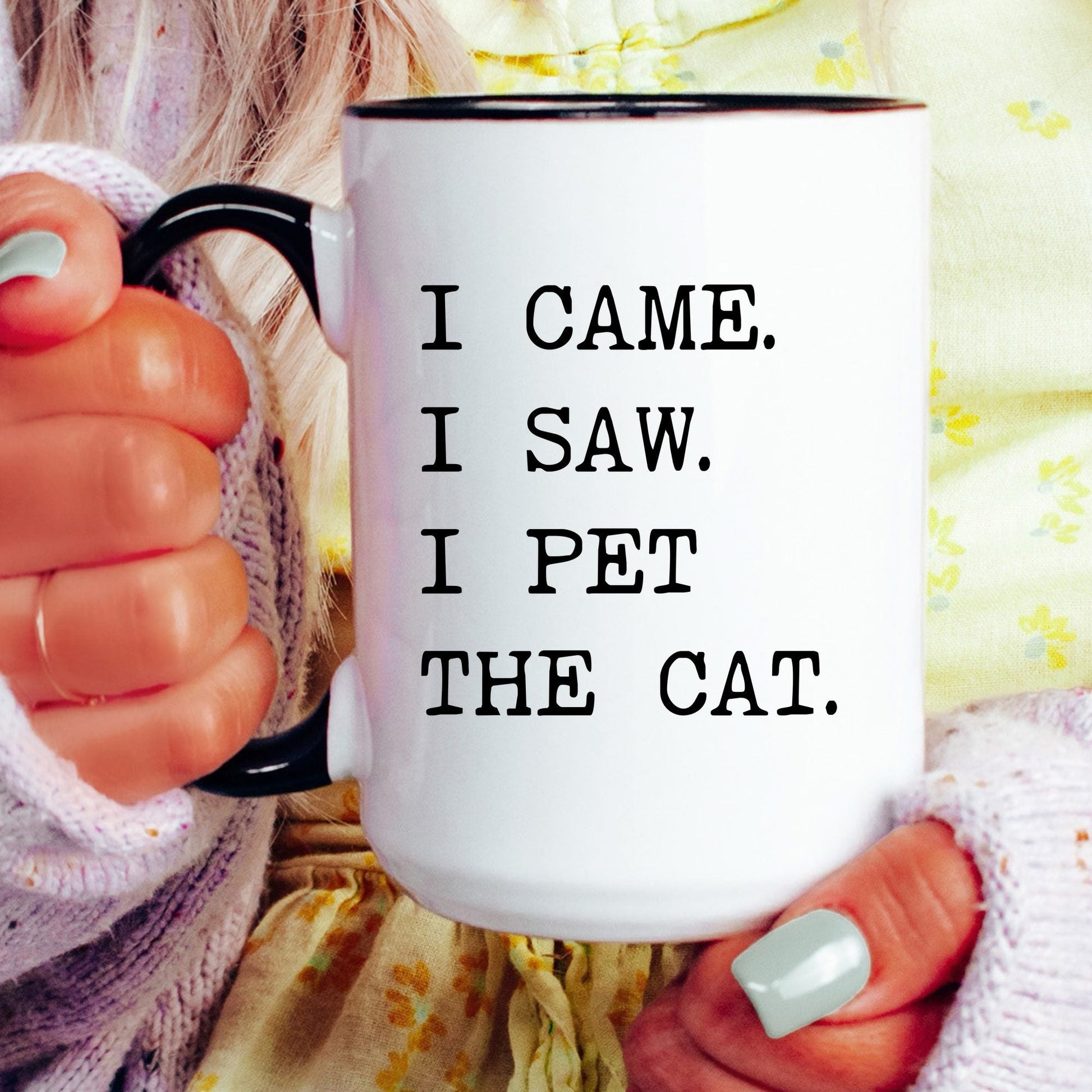 I Came I Saw I Pet the Cat coffee mug held by a model
