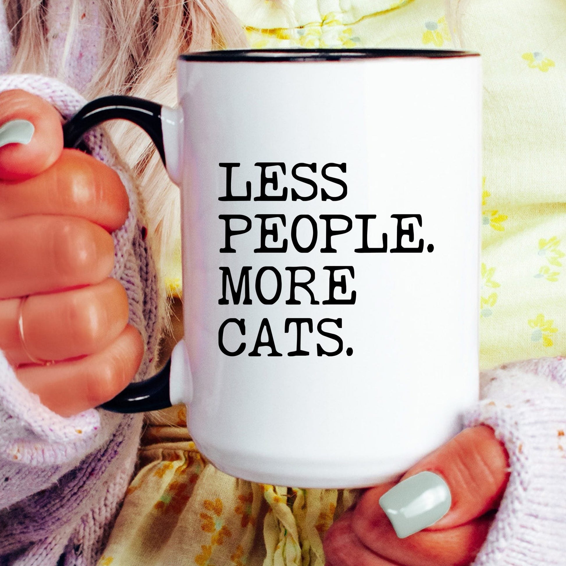 Less People More Cats coffee mug held by a model
