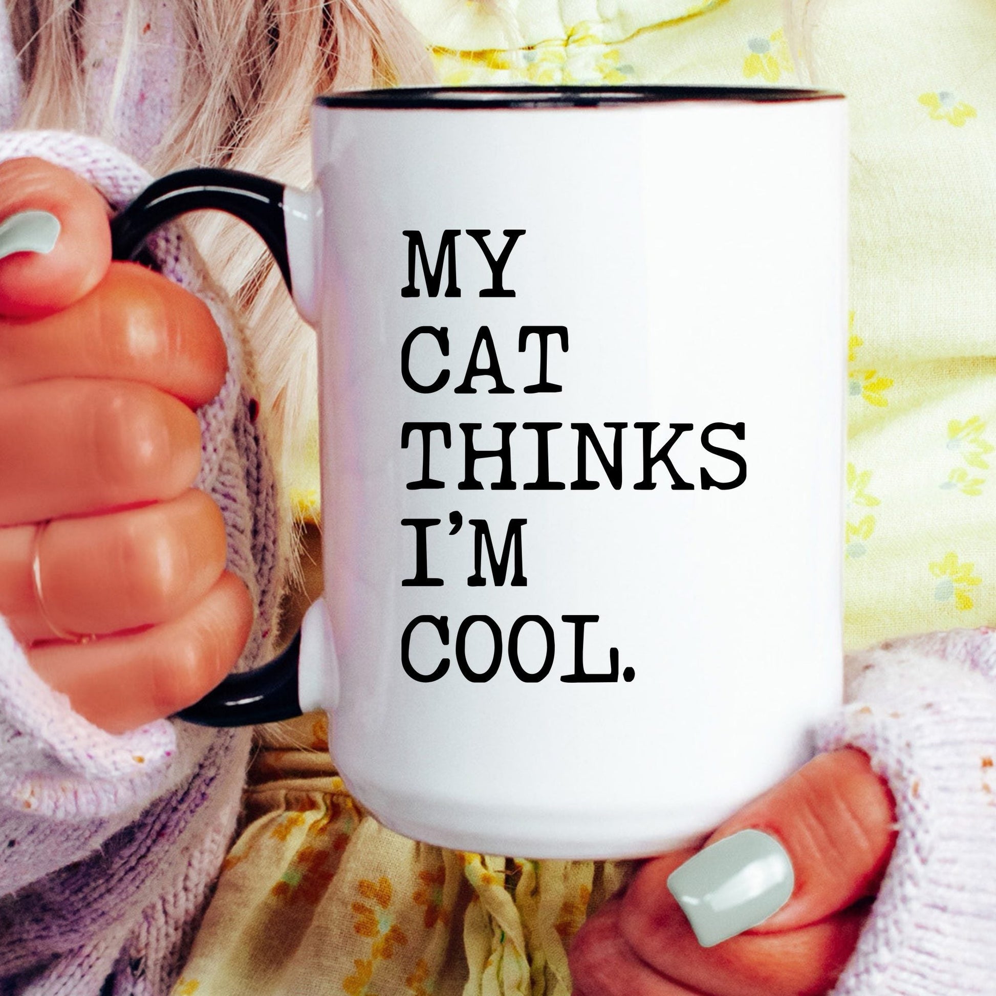 My Cat Thinks I’m Cool coffee mug held by a model