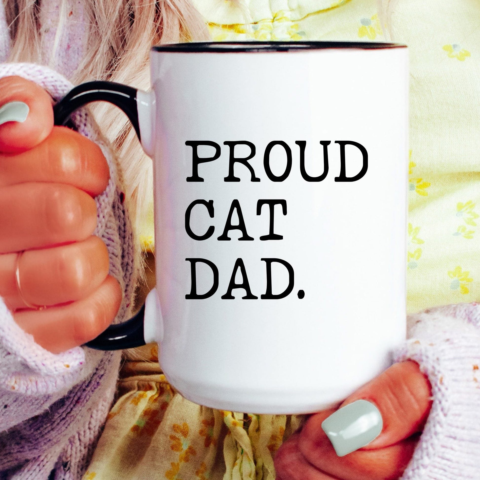 Proud Cat Dad coffee mug held by a model