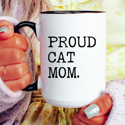 Proud Cat Mom coffee mug held by a model