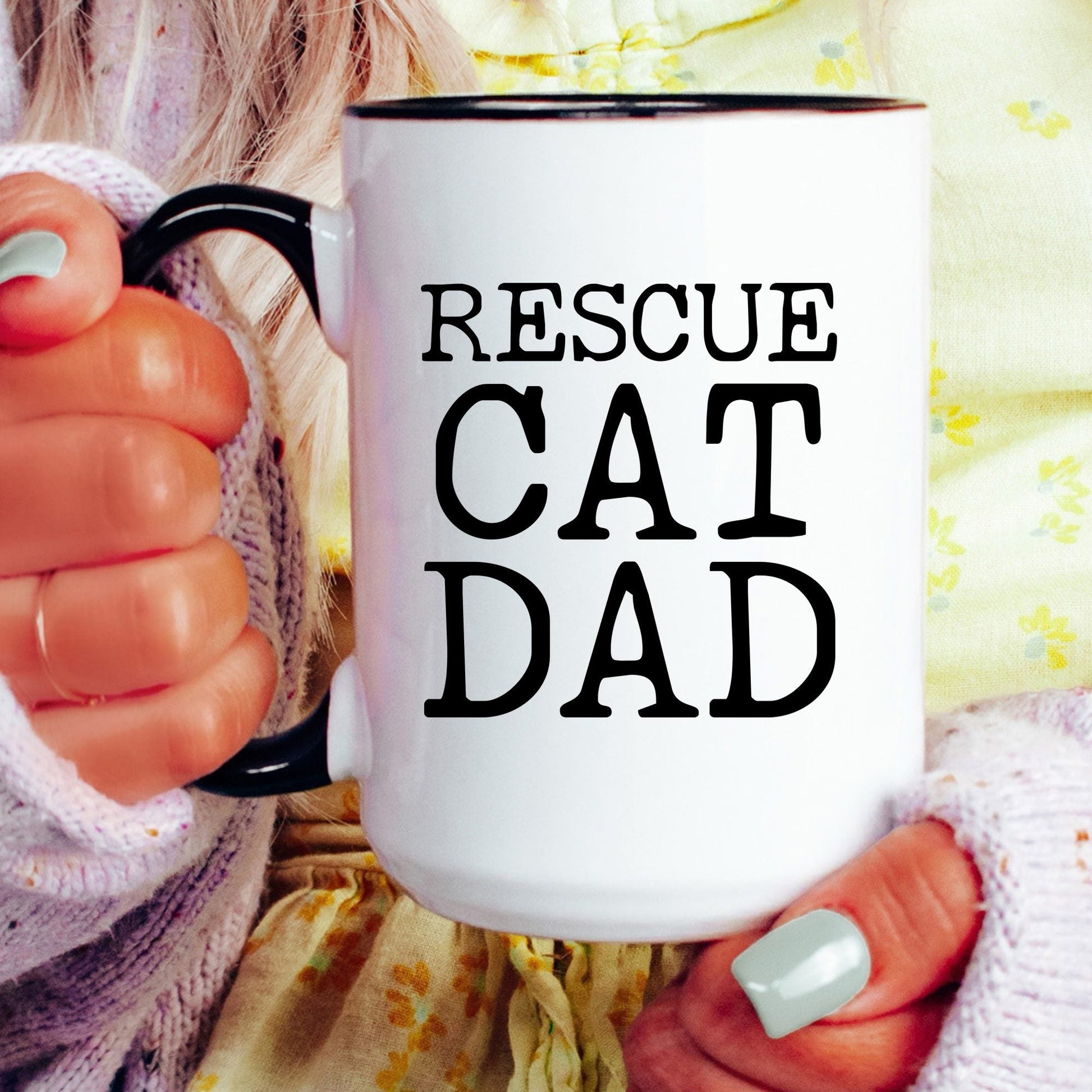 Rescue Cat Dad coffee mug held by a model