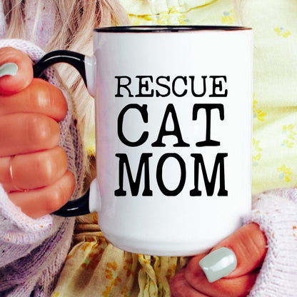 Rescue Cat Mom coffee mug held by a model