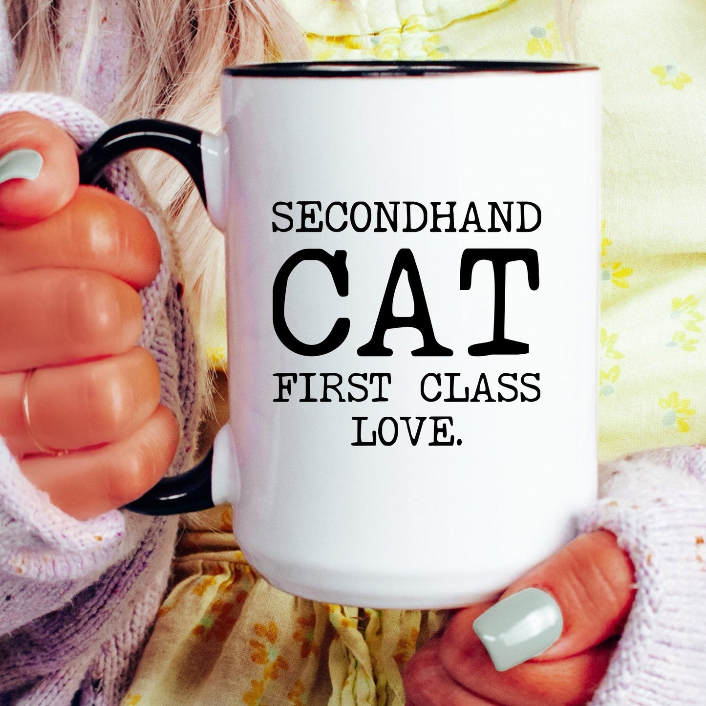 Secondhand Cat First Class Love coffee mug held by a model