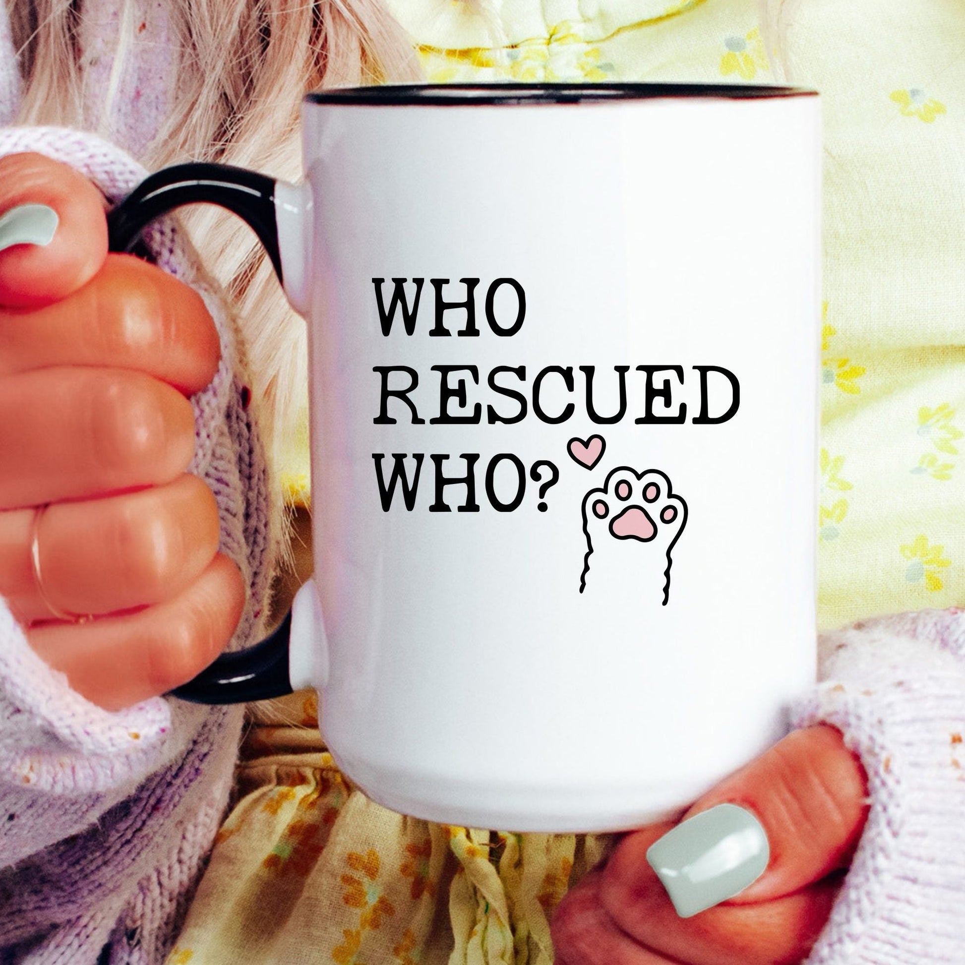 Who Rescued Who coffee mug held by a model