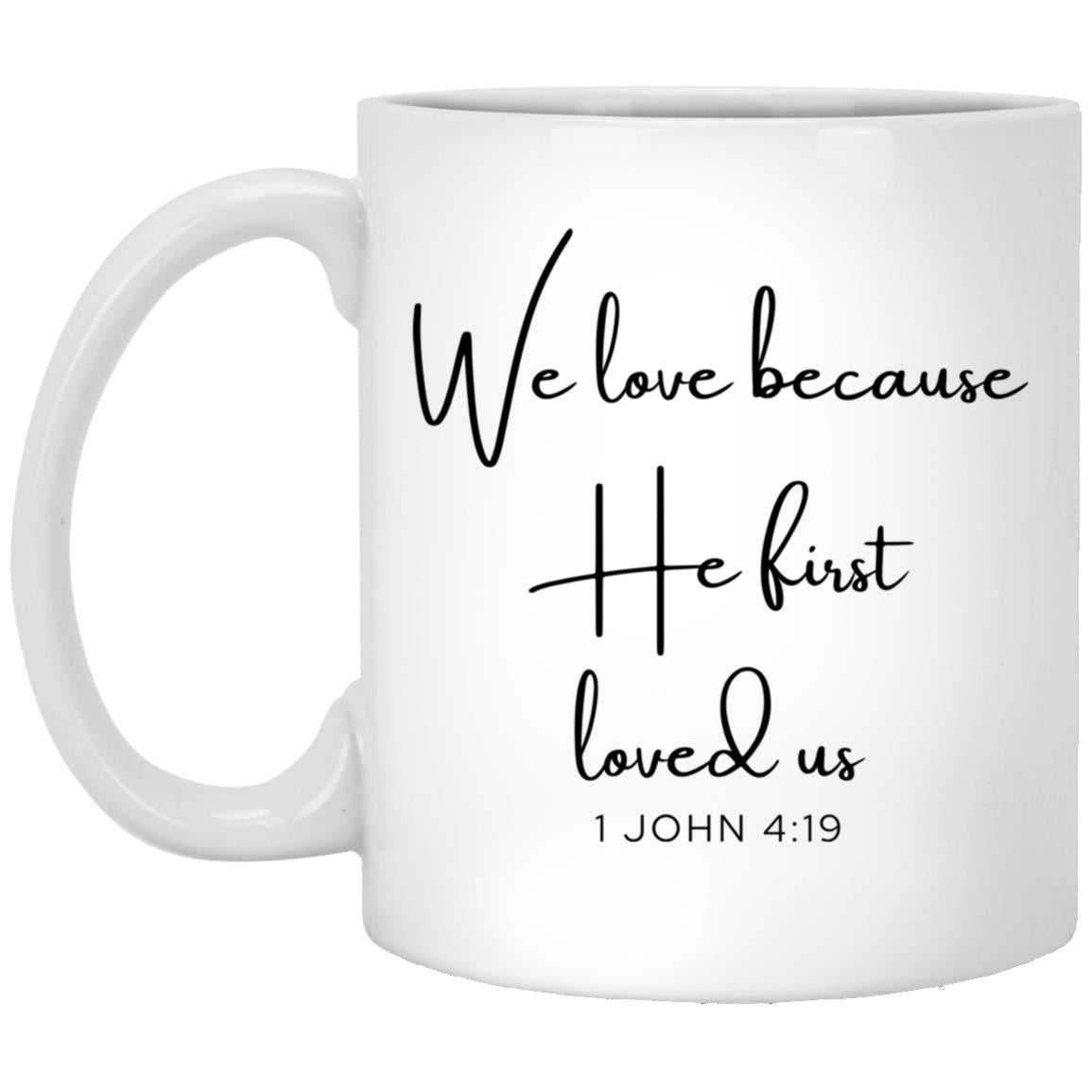 We love because he first loved us. coffee mug