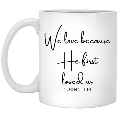 We love because he first loved us. coffee mug